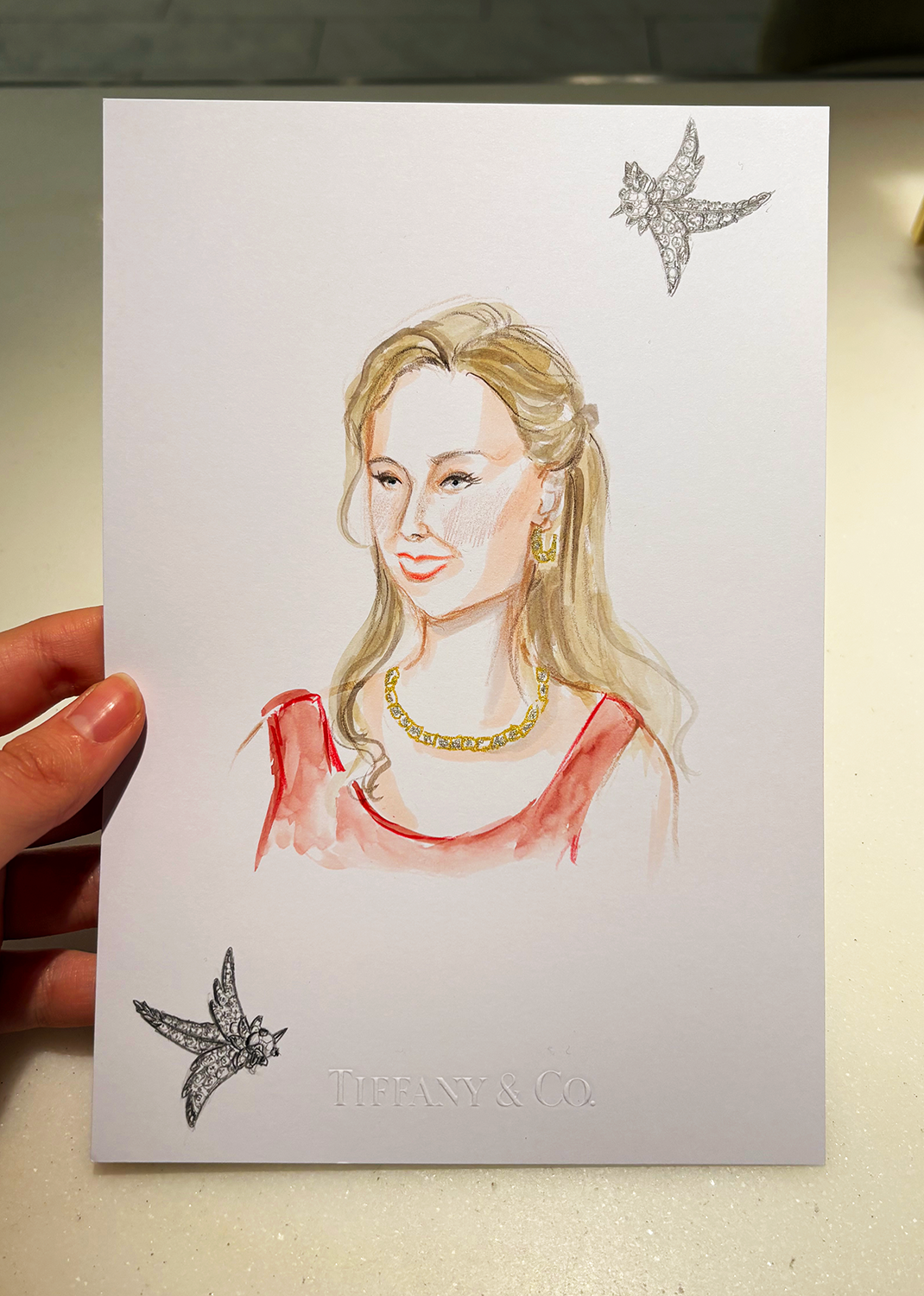 Portrait of woman wearing red dress and Tiffany's jewelry