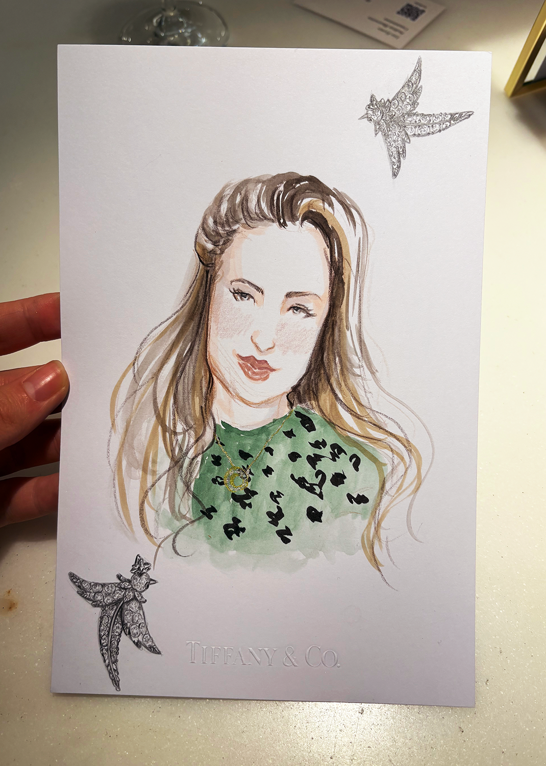 Portrait of woman wearing green dress and Tiffany's jewelry